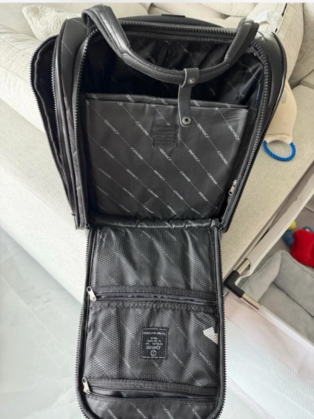 Joan & David Stylish Black Quilted Carry-On office  on wheels. Unisex